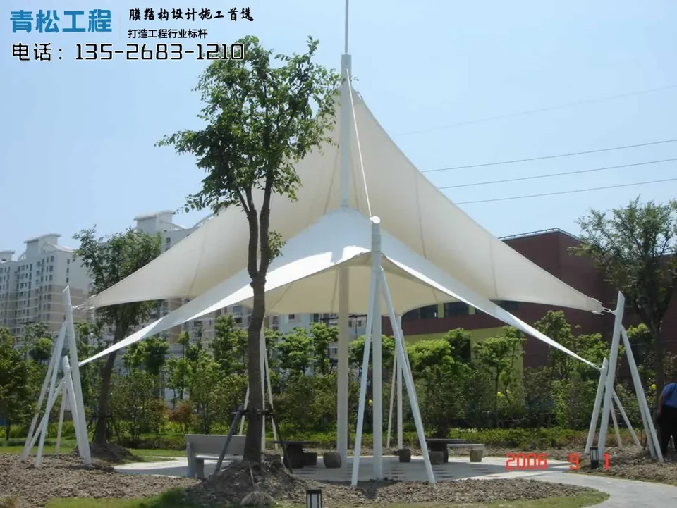 Residential landscape canopies with varied roof heights and shaded seating