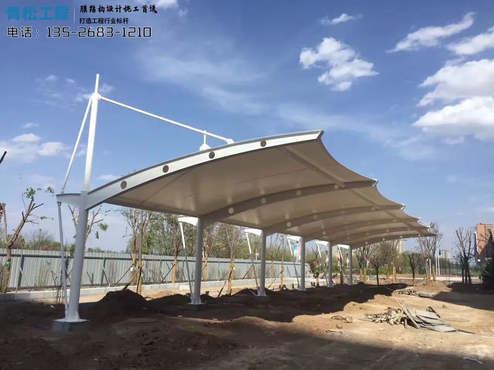 Carport installation site with continuous membranes, curved edge beams and unfinished ground