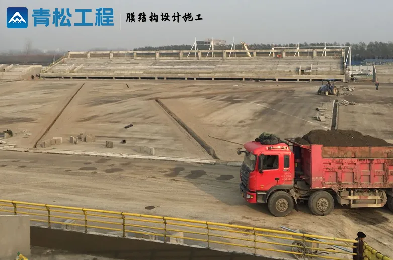 Luyi stadium during construction, showing the site and grandstand supports