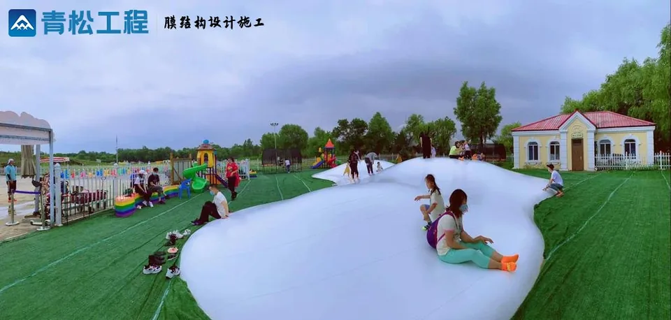 Inflatable play clouds on grass — reference image
