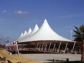 Landscape canopy gallery: repeated peaks beside an open plaza