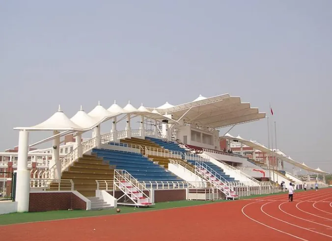 Grandstand membrane pretension: how much is appropriate?